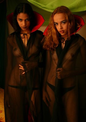 18 year old female Doris G slips off her underwear to pose naked on her bed